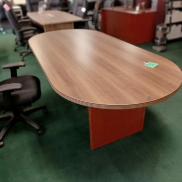 Floor model 8' oval conference table walnut with cherry base.